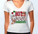 White t-shirt with 'Hot Cocoa Season' graphic design on a plain background
