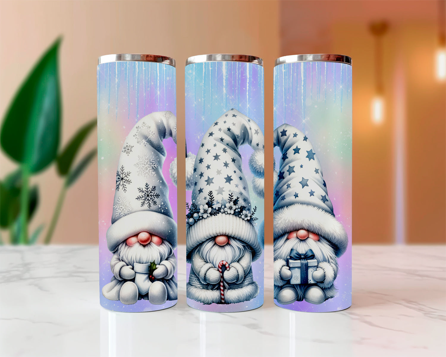 Three tumbler with gnome designs on a white surface with a blurred background