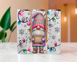 Three Christmas-themed tumblers with a gnome design on a white surface.