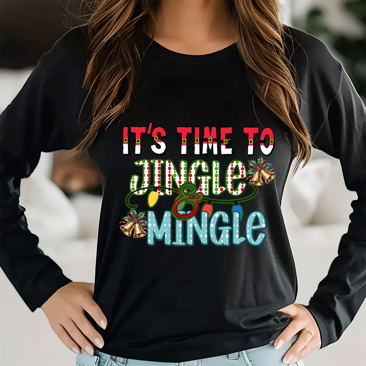 Black long-sleeve shirt with colorful text and graphics, worn by a person indoors.