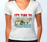 White t-shirt with colorful text 'It's Time to Jingle Mingle' on a plain background