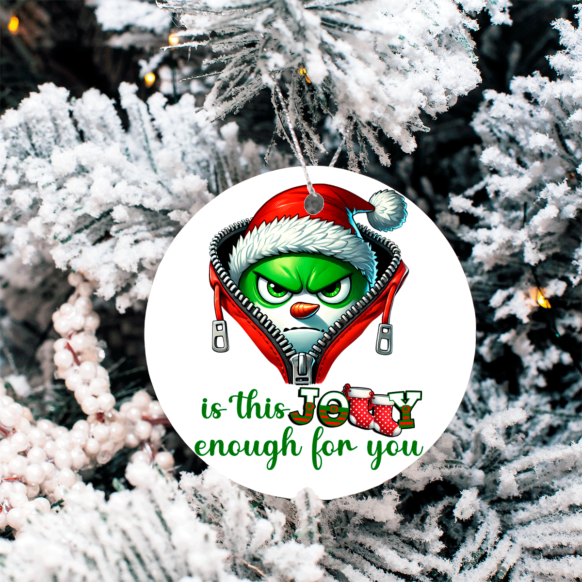Christmas ornament with Grinch design on a snowy tree background