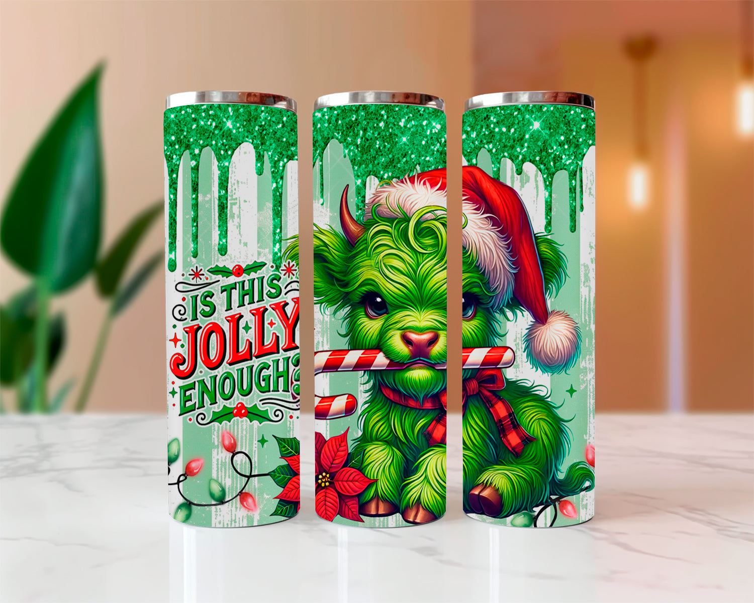 Three green tumblers with a festive design featuring a green creature and candy cane.
