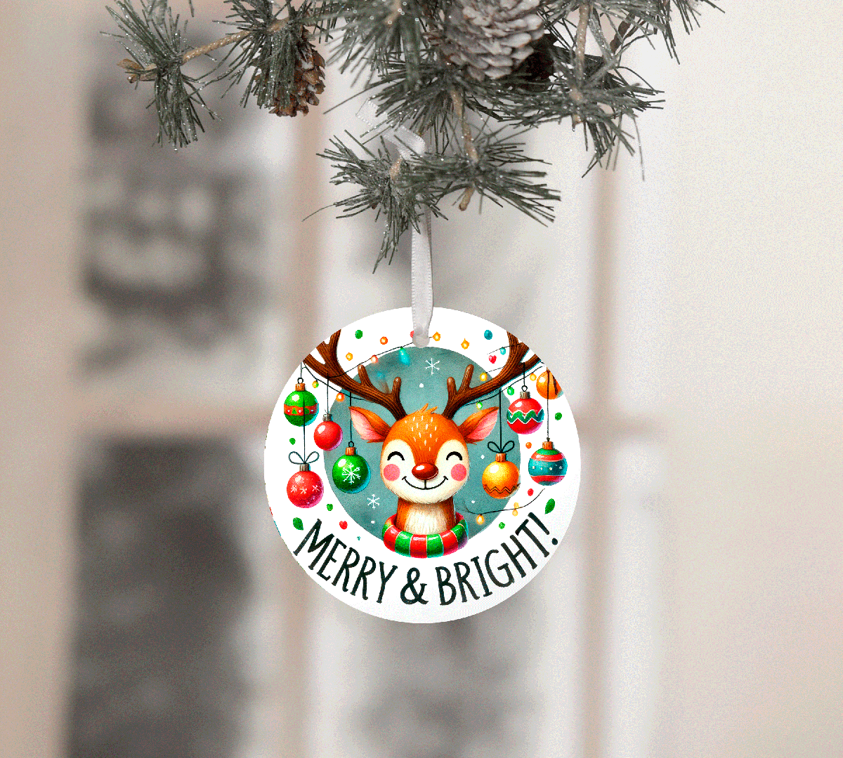 Circular Christmas ornament with a reindeer design and 'Merry & Bright!' text, hanging from a tree.