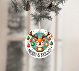 Circular Christmas ornament with a reindeer design and 'Merry & Bright!' text, hanging from a tree.