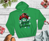 Green hoodie with a Christmas-themed design of a cat wearing a red hat on a wooden surface.