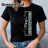 Person wearing a black t-shirt with 'Merry Christmas' design.