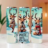 Three tumbler cups with reindeer designs and Christmas-themed text on a light background.