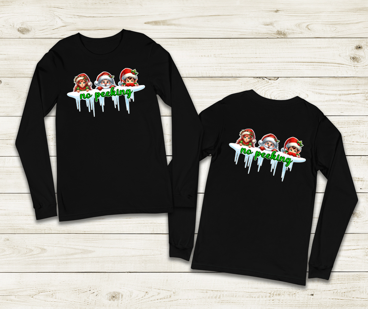 Two black long-sleeve shirts with Christmas-themed graphic on a wooden surface