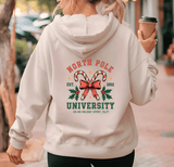 Person wearing a hoodie with 'North Pole University' design, holding a coffee cup.