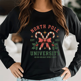 Black sweatshirt with Christmas-themed design featuring candy canes and holly, worn by a person.