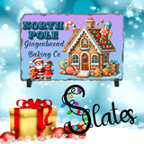 Promotional graphic for North Pole Gingerbread Baking Co Slates with a gingerbread house and Santa Claus on a snowy background.