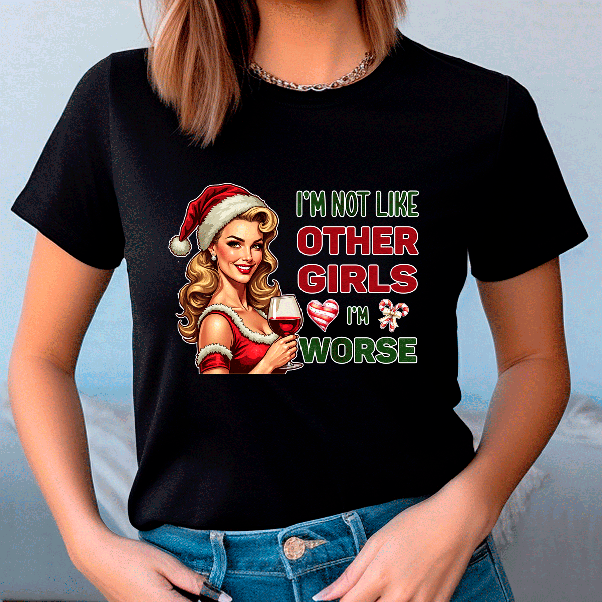 Black t-shirt with Christmas-themed graphic and text worn by a person.