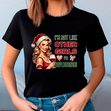 Black t-shirt with Christmas-themed graphic and text worn by a person.