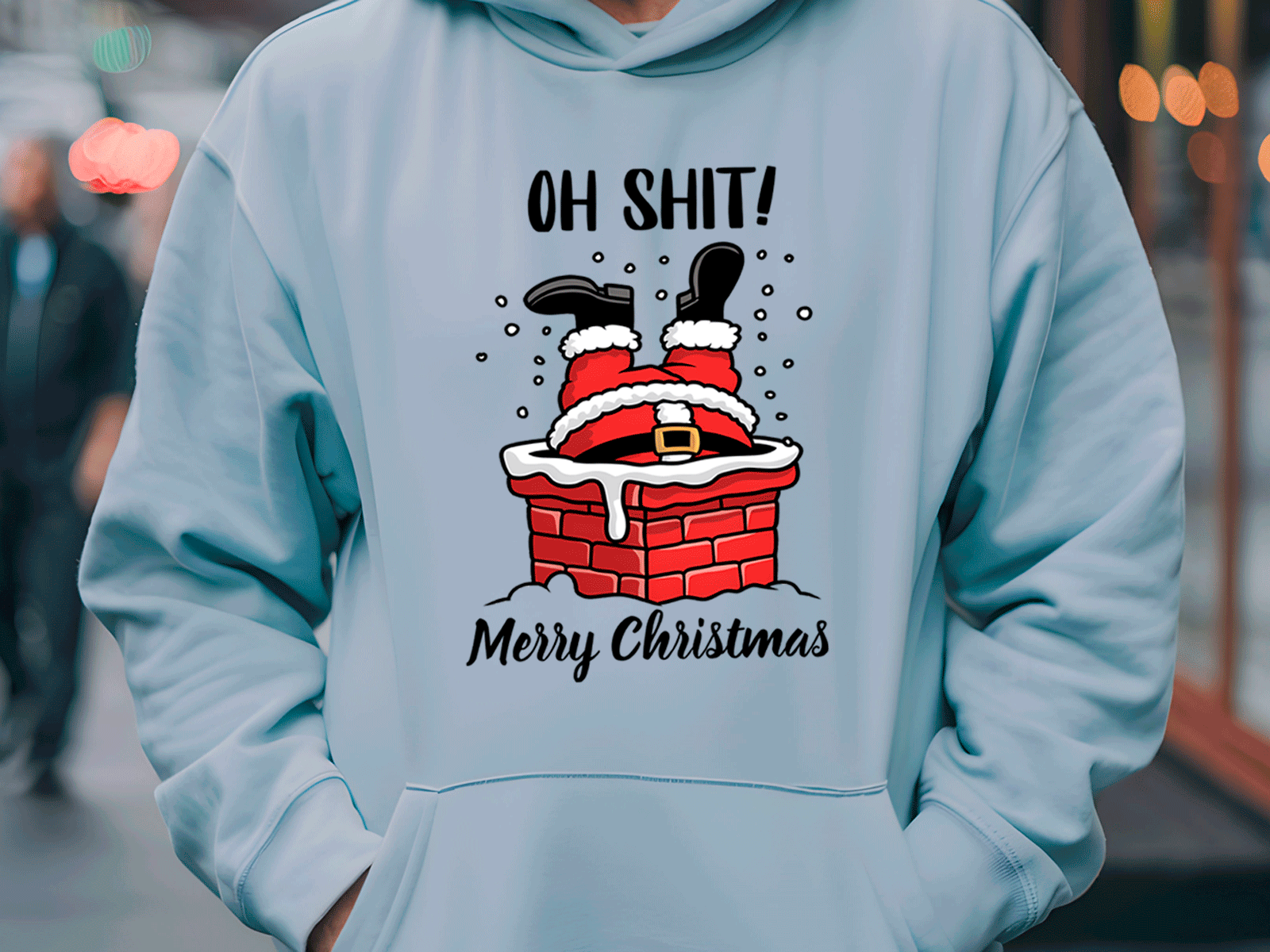 Light blue hoodie with a graphic of Santa Claus falling into a chimney and text 'OH SHIT! Merry Christmas' on a blurred street background.