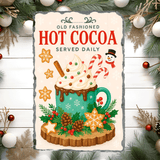Decorative sign for hot cocoa with festive elements on a wooden background.