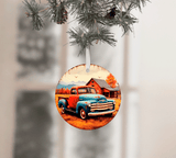 Circular Christmas ornament with a vintage truck design hanging from a tree branch.