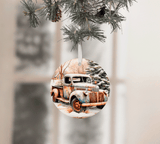 Decorative Christmas ornament with vintage truck design hanging on a tree.