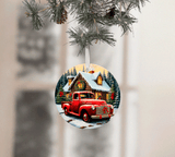Christmas ornament with a red truck and cabin design, hanging from a tree.