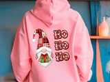 Pink hoodie with Christmas-themed design featuring a gnome and 'HO HO HO' text.
