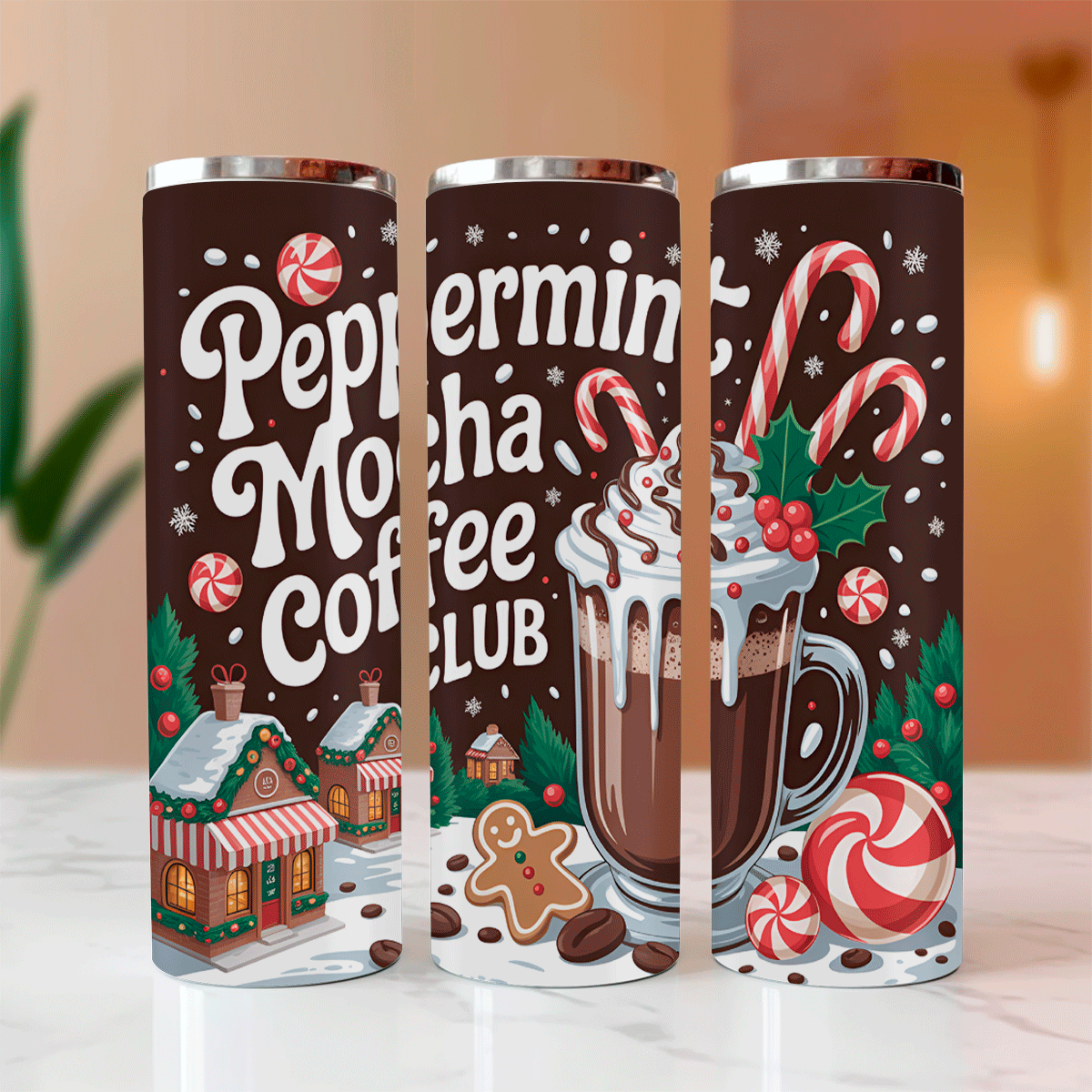 Three Peppermint Mocha Coffee Club tumblers with festive design on a blurred background