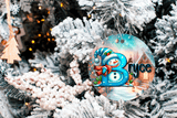 Decorative ornament with a snowman design and the name 'Bryce' on a Christmas tree.