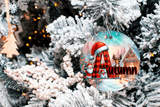 Decorative ornament with a Santa Claus design on a Christmas tree.