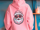 Pink hoodie with a Santa Claus design wearing sunglasses against a blue wall.