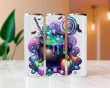 Three white tumblers with colorful Halloween-themed designs on a light surface.
