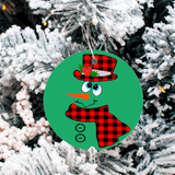 Circular Christmas ornament with a snowman design on a tree
