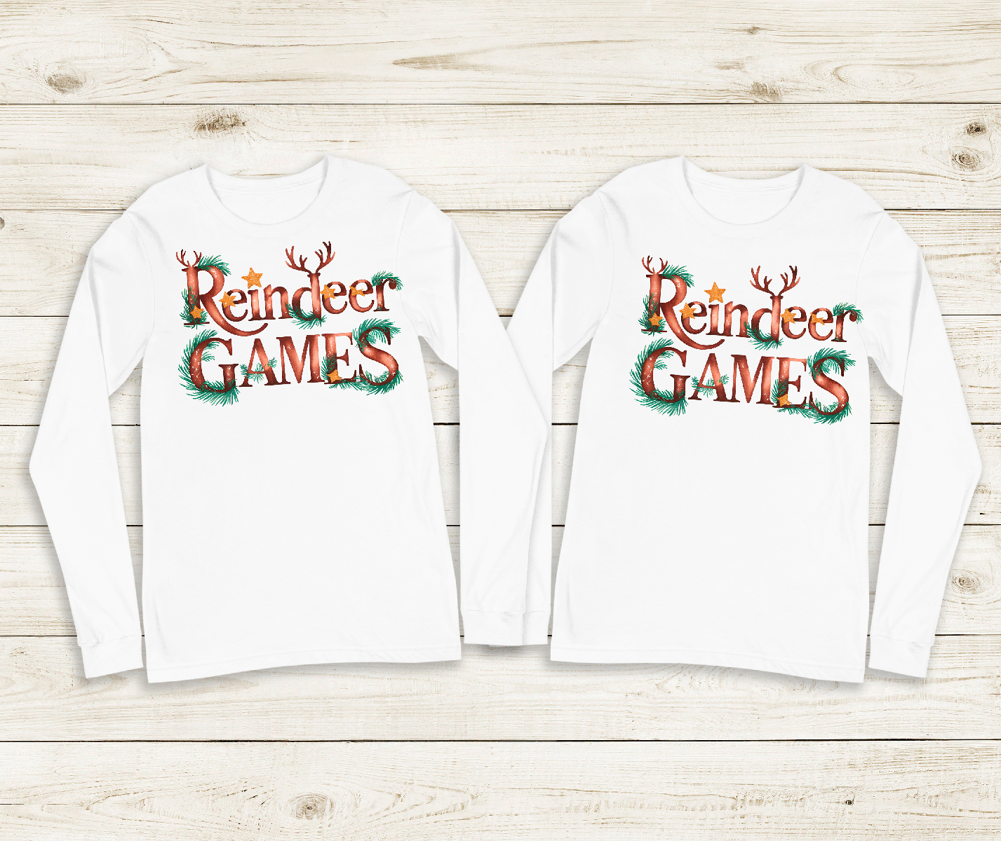 Two white long-sleeve shirts with 'Reindeer Games' text on a wooden surface