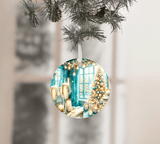 Round Christmas ornament with festive design of a window, tree, and champagne glasses on a blurred background.