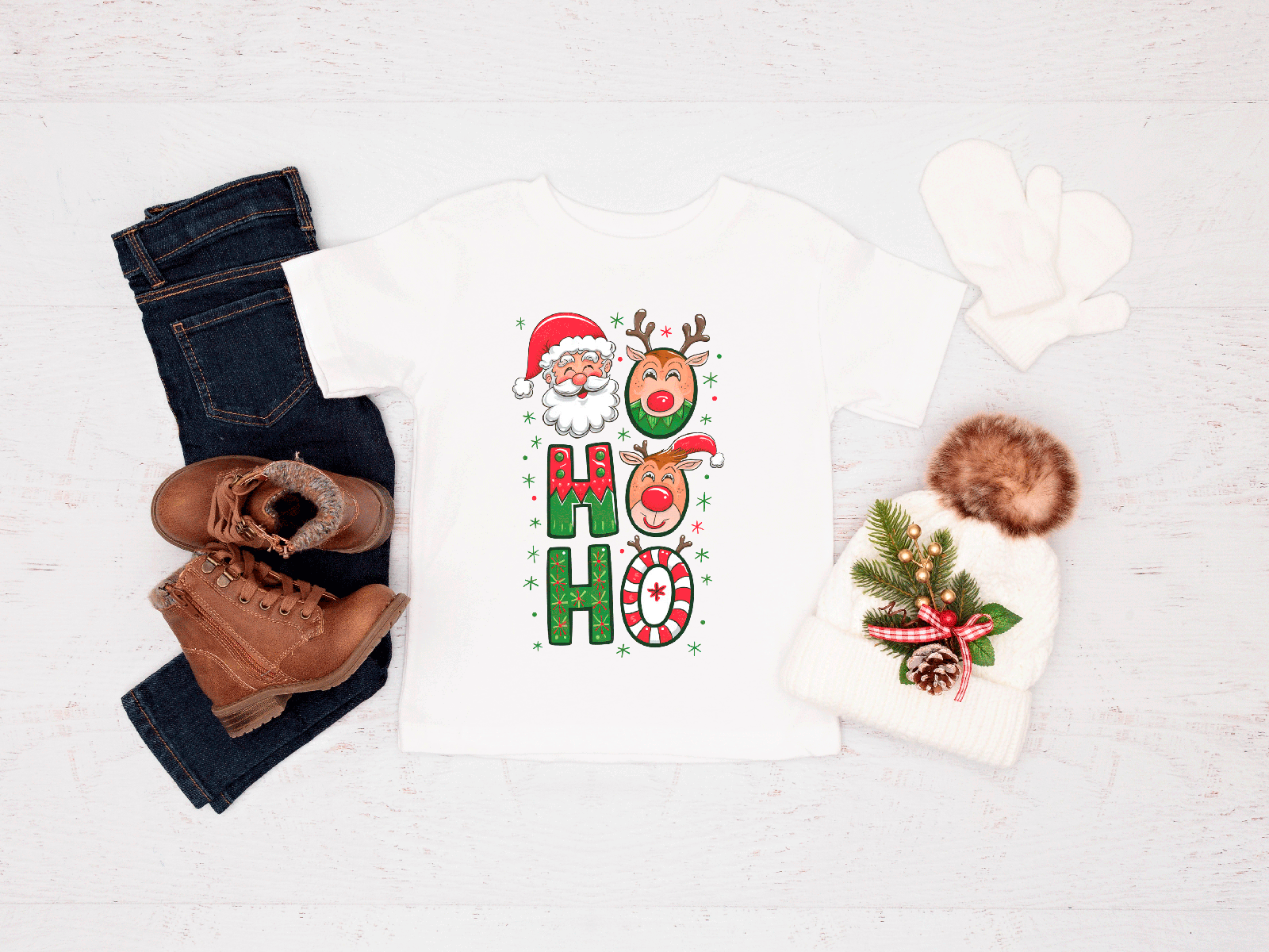 Christmas-themed shirt with reindeer and Santa Claus design, paired with jeans and boots on a white background.