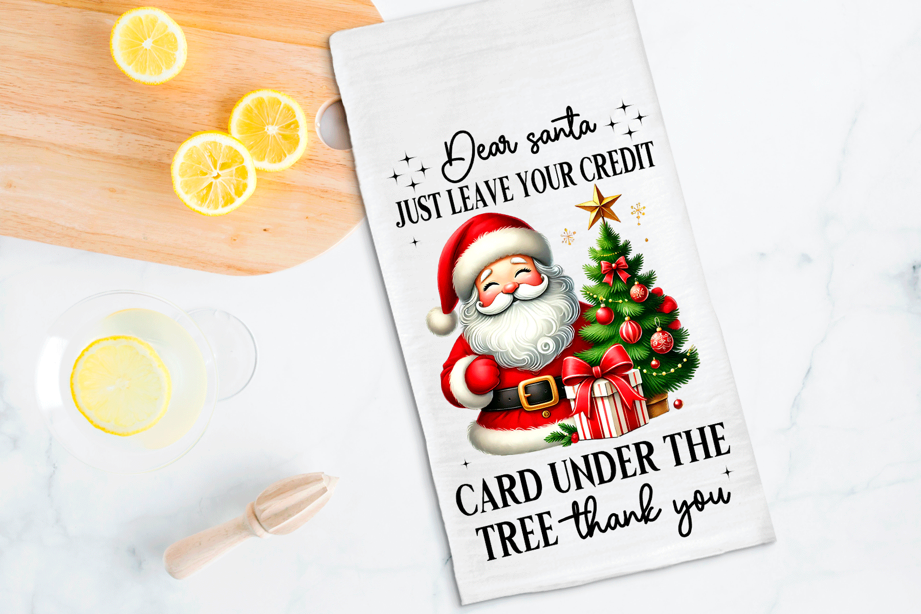 Card with Santa Claus illustration and humorous text on a kitchen counter with lemons.