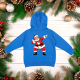 Blue hoodie with a cartoon Santa Claus design on a wooden background with Christmas decorations.