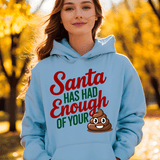 Person wearing a light blue hoodie with a humorous design in an outdoor setting.