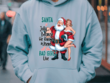 Light blue hoodie with Santa Claus graphic and text in an urban setting