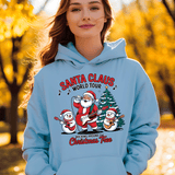 Person wearing a light blue hoodie with Santa Claus design in an autumn setting