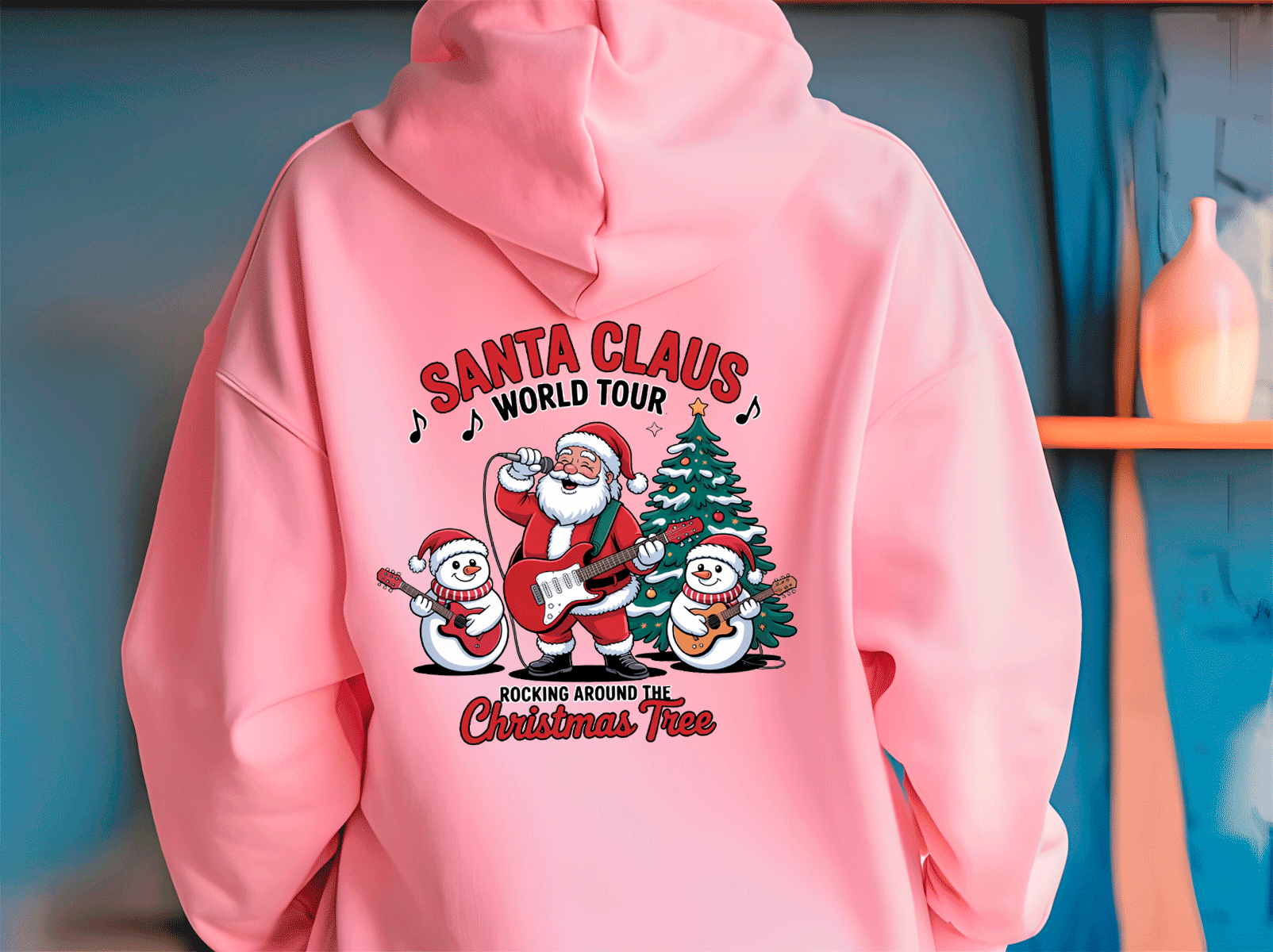 Pink hoodie with Santa Claus graphic and text on a blue background