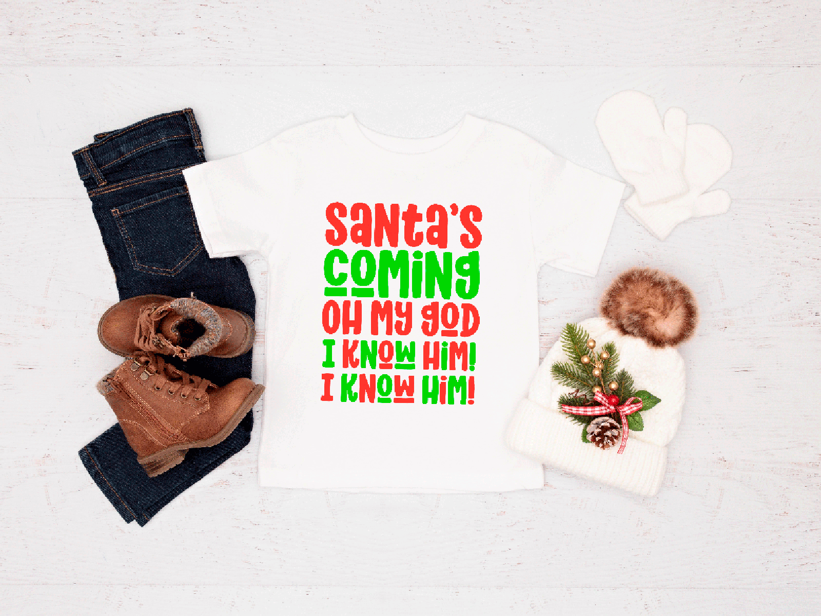 Christmas-themed items including a tee, jeans, boots, and a hat with text on a white background
