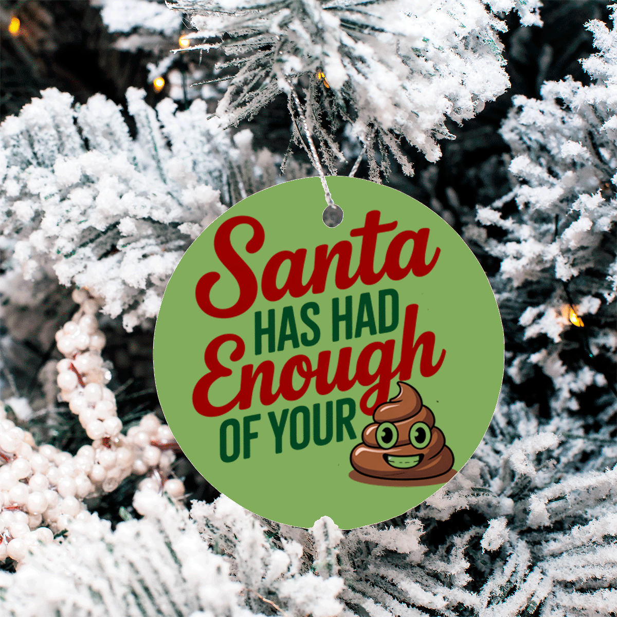 Christmas ornament with text 'Santa has had enough of your poop' on a snowy tree background