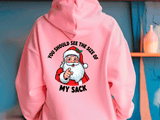 Pink hoodie with a graphic of Santa Claus and text on a blue background