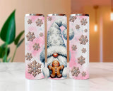 Three tumblers with winter-themed designs on a light surface.