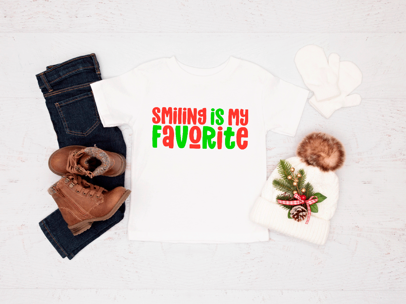 Holiday-themed outfit with a Tee, jeans, boots, and a hat on a white background with 'Smiling is my favorite' text.
