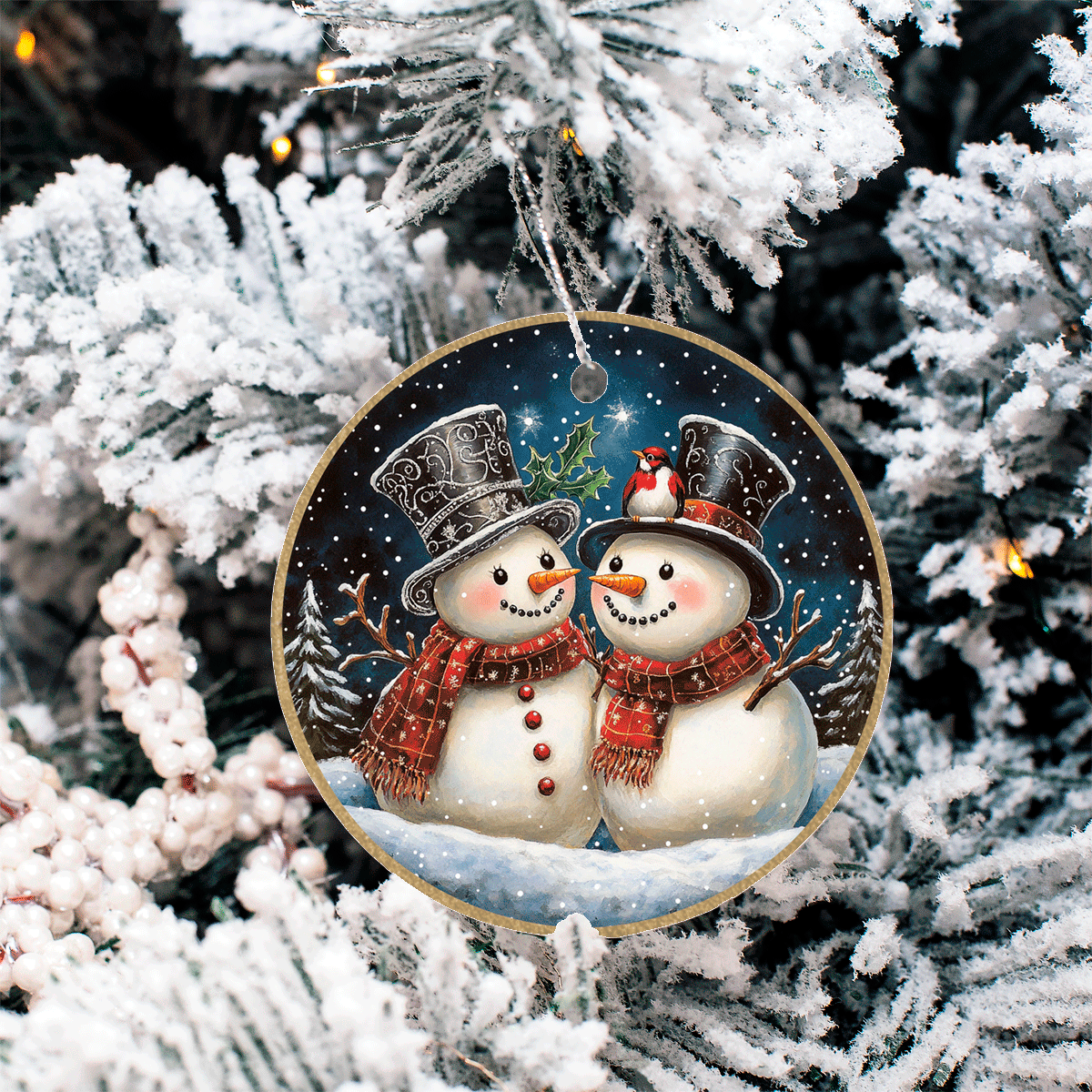 Decorative Christmas ornament with two snowmen on a tree