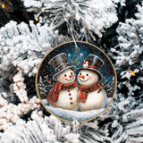 Decorative Christmas ornament with two snowmen on a tree
