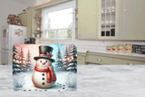 Christmas gift bag with a snowman design in a kitchen setting