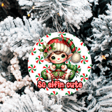 Christmas ornament with a elf design on a snowy tree background