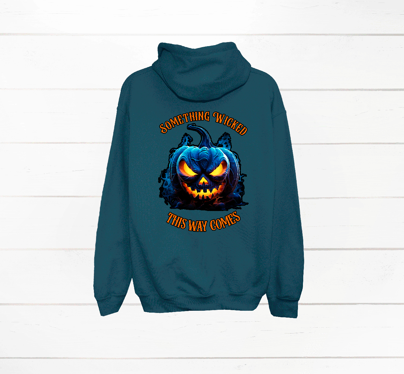 Teal hoodie with a pumpkin graphic and text on the back against a white wooden background