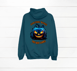 Teal hoodie with a pumpkin graphic and text on the back against a white wooden background